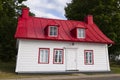 Ancestral house with red tin roof in Saint-Jean, Island of Orleans, Quebec