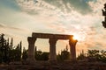 Anchient ruins of temple in Corinth, The lights of sun brights through. Greece - archaeology background Royalty Free Stock Photo