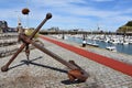 Anchor and boats in marina of Fecamp, Normandy