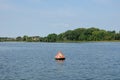 Anchor buoys specify borders on the lake Royalty Free Stock Photo