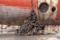 Anchor chain collected near ships hull. Royalty Free Stock Photo