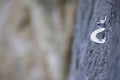 Anchor climbing on a rock wall. New iron piton. Rock climbing hook. Color picture of a fastening screw for climbing on a Royalty Free Stock Photo