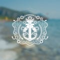 Anchor cross with two cannons in center of frame from line pattern and rope. Marine vintage label on sea blurred photo background