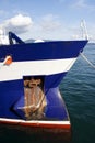 Anchor and draft marks on the bow hull of a moored ship in the dock Royalty Free Stock Photo