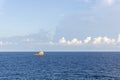 An anchor handling tug boat maneuvering at offshore oil field