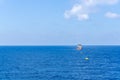 An anchor handling tug boat maneuvering at offshore oil field