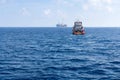 An anchor handling tug boat maneuvering at offshore oil field