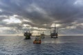 An anchor handling tug boat maneuvering at an oil production platform at Terengganu oil field