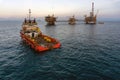 An anchor handling tug boat performing anchor deployment at offshore oil field