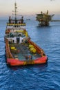 An anchor handling tug boat performing anchor deployment at offshore oil field