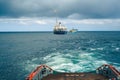 AHTS vessel doing static tow tanker lifting. Ocean tug job Royalty Free Stock Photo