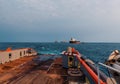 AHTS vessel doing static tow tanker lifting. Ocean tug job Royalty Free Stock Photo