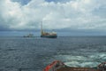 AHTS vessel doing static tow tanker lifting. Ocean tug job Royalty Free Stock Photo