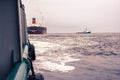 Anchor-handling Tug Supply AHTS vessel at work with FPSO tanker Royalty Free Stock Photo