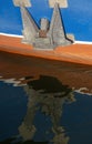 Anchor and hull of a sailing ship reflecting in the water surface Royalty Free Stock Photo