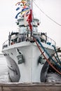 The anchor of a large warship standing in the port. Bow of a ship with an anchor on the side. Royalty Free Stock Photo