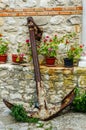 Anchor near the wall with flowers