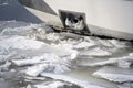 Anchor on the ship covered with ice next to the river covered with broken ice floes