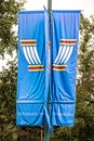 2022_06_25 Anchorage Alaska USA - Indiginous- First Peoples Flag banner on post with traiditonal symbol on top and ATHABASCAN Royalty Free Stock Photo