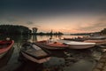 Anchored boats on a river bank