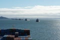 Anchored bulk cargo vessels observed from merchant container ship sailing through Columbia river, Oregon. Royalty Free Stock Photo