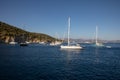 Anchored sailboats off the coast of the KASTOS island, Lefkada Regional unit, Ionian Islands, Greece in summer morning. Royalty Free Stock Photo