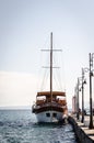 Anchored tourist boat by the waterfront in Pefkochori, Greece