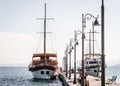 Anchored tourist boat by the waterfront in Pefkochori, Greece