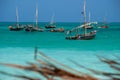 Anchored Traditional wooden dhow boats on the amazing turquoise water in the Indian ocean at Nungwi village, Zanzibar Royalty Free Stock Photo