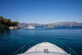 Anchored yacht and sailboats off the coast of the KASTOS island, Ionian Islands, Greece in summer morning. Royalty Free Stock Photo