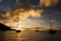 Anchoring ships in tropical bay at sunset. Small yachts and catamarans on sea water during dusk. Santa Lucia.