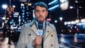 Anchorman Reporting Live News in a City at Night. News Coverage by Professional Handsome Reporter