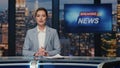 Anchorwoman ending tv news evening program closeup. Presenter going from studio Royalty Free Stock Photo