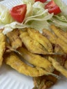 Anchovies battered with flour and fried with lemon Royalty Free Stock Photo