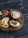 Anchovy and goat cheese sandwich on rustic wooden board Royalty Free Stock Photo