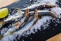 Anchovy served on layer of sea salt