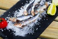 Anchovy served on layer of sea salt