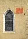 Anciant church window with sun dial Royalty Free Stock Photo