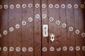 Anciend wood door with metal silver decoration