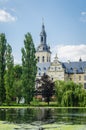 Ancient abbey church on lake with birds