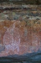 Ancient Aboriginal Art: hand prints, animal herds, spiral, Kakadu National Park, Australia Royalty Free Stock Photo