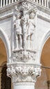 Ancient aged sculpture of beautiful Eva with apple and Adam from Bible story of Creation at Doge Palace in Venice, Italy, closeup