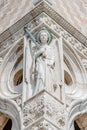 Ancient aged sculpture of beautiful Noble woman with sword and papyrus at Doge Palace in Venice, Italy, closeup, details