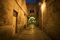 Ancient alley in Jewish Quarter at night time, the old city Jerusalem. Mystical atmosphere of deserted road leading to an old city Royalty Free Stock Photo
