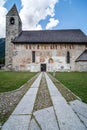Ancient alpine church with exterior walls frescoed