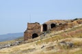 Ancient antique amphitheater in city of Hierapolis in Turkey. Side view. Steps and antique statues with columns in the