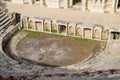 Ancient antique amphitheater in city of Hierapolis in Turkey. Steps and antique statues with columns in the amphitheater Royalty Free Stock Photo