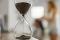 An ancient antique hourglass detects time. Royalty Free Stock Photo