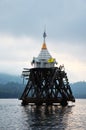 Ancient antique ruins ubosot of Wat Sri Suwan drown deep underwater of Songkalia river at sunset dawn time for thai people and