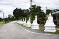 Ancient antique white buddha statue on beside road street for thai people traveler travel visit and respect praying blessing holy Royalty Free Stock Photo